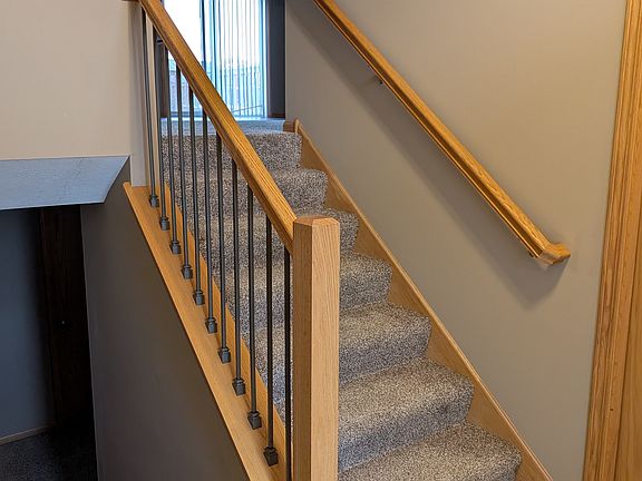 Split level entry with coat closet and door to 2-car garage