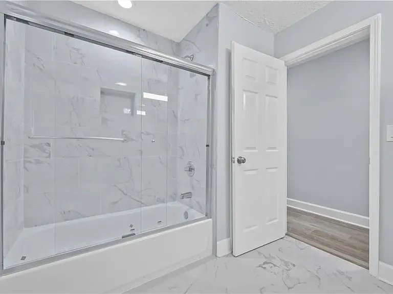 Main bath in corridor.