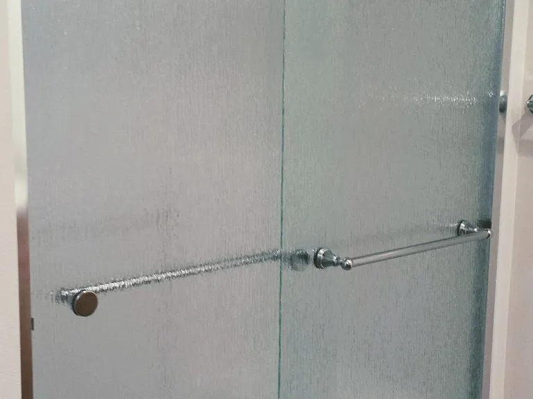 Upgraded rain glass sliding doors, walk- in shower in Primary suite bathroom