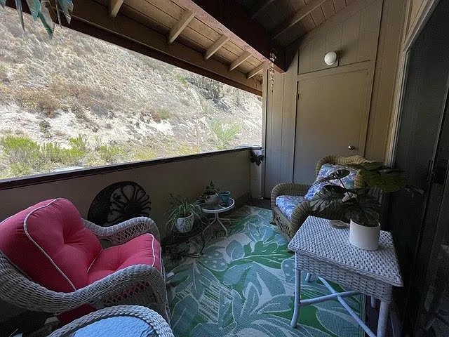 Balcony with two comfy rockers.