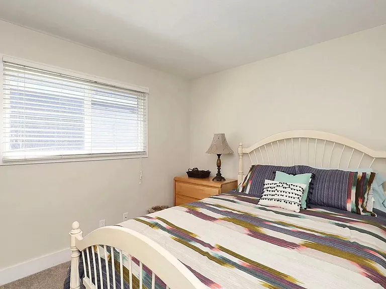 Queen bed in downstairs bedroom
