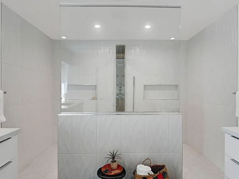primary bathroom / dual sinks /door to pool area