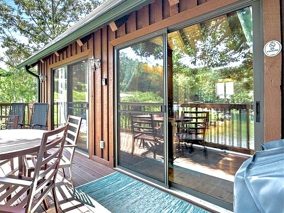 Roommates private porch with her private entrance. Her porch has a shared gas grill.