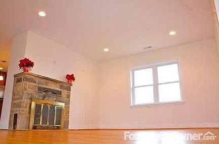 Living Room
						:
						Living Room with wood burning fireplace looks out to large lot