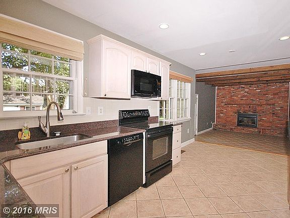 Updated kitchen with granite opens to family room