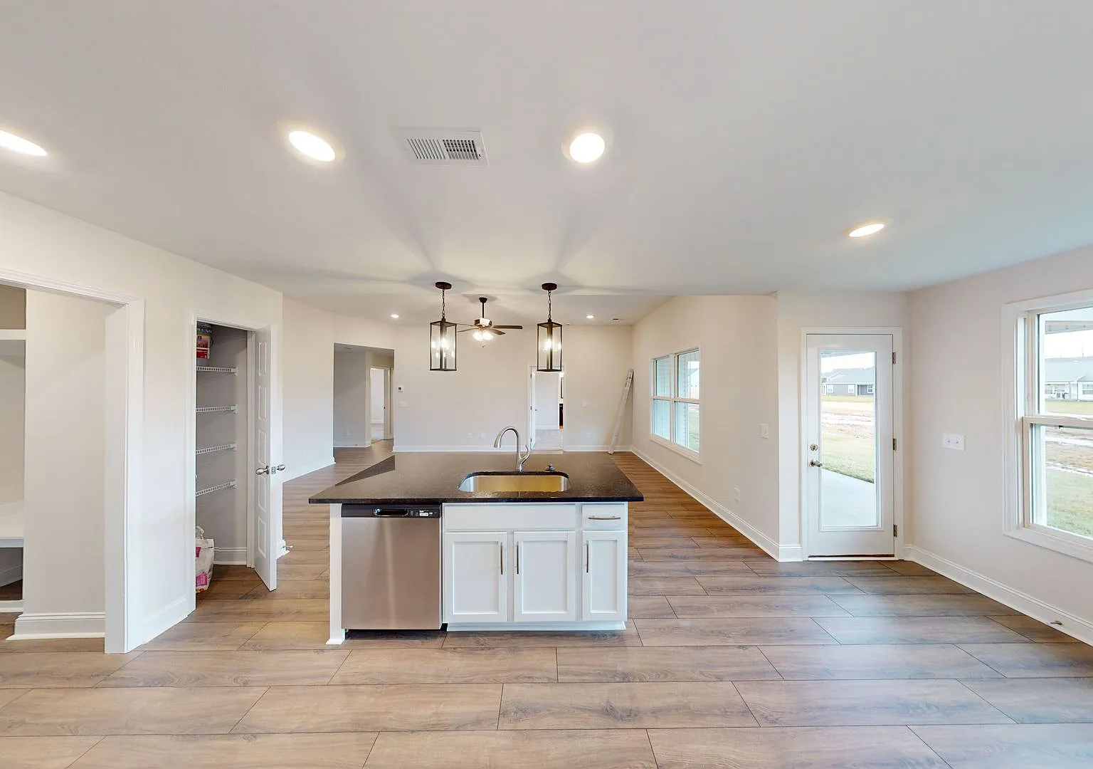 Open-Concept Home with Modern Upgrades Featuring Hardwood Flooring and Open Kitchen — Photo 4