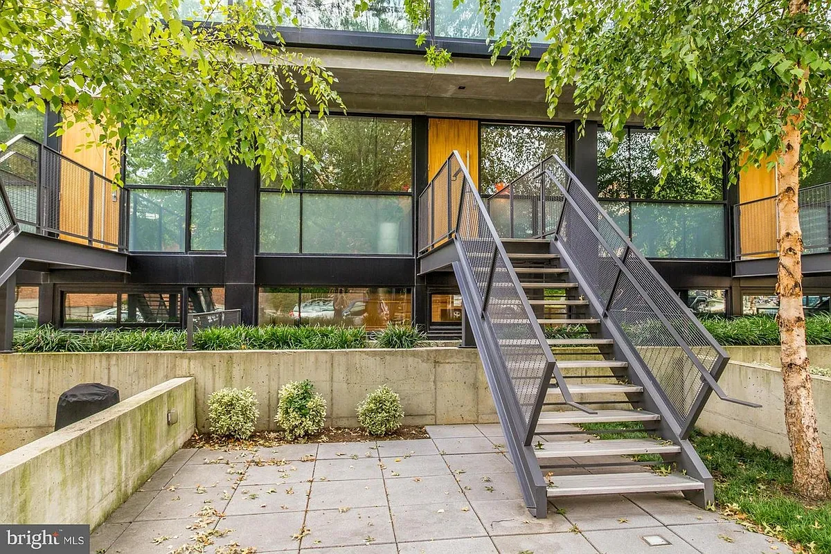 Photo 1 of 38 - 2250 11th St NW #103 - Washington, DC Private street-level entrance and a 400 sq. ft. walled-in patio facing 11th Street NW. - 2250 11th St NW #103