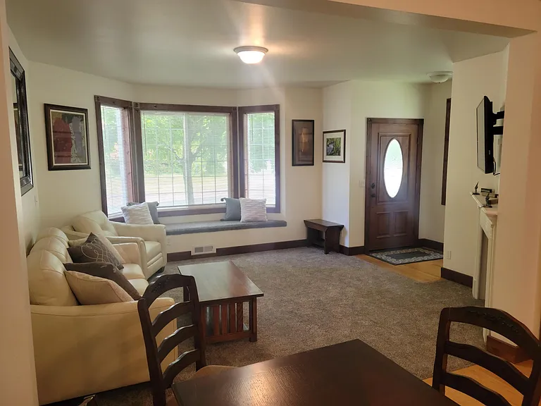 Matching leather couch and chair in living room. Quality furniture and tasteful decor throughout the entire home.