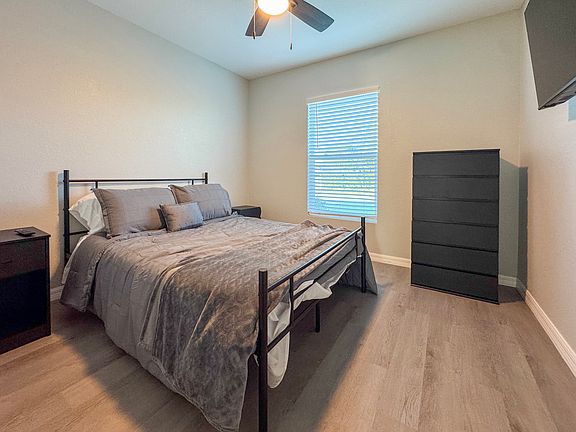 Primary bedroom with modern finishes, walk-in closet, and private ensuite bathroom.