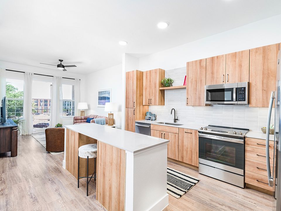 Elevate your culinary experience with Modera Trinity's premium homes. From expansive kitchen islands to built-in dry bars, front-control ranges, and discreetly hidden dishwashers, every detail caters to your modern lifestyle and culinary aspirations.