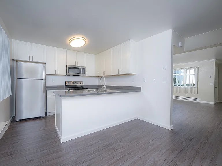 Experience the elegance of this modern kitchen and living space, perfect for entertaining.