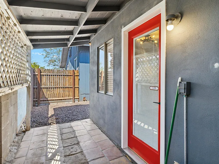 Back patio which leads to the laundry area or to the private backyard!