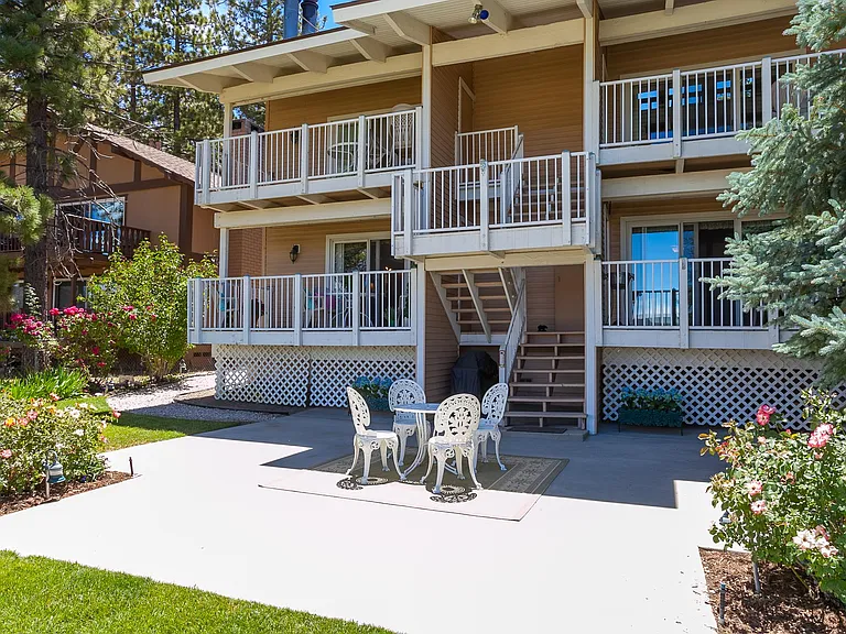 Backyard with private balconies and patio sets. BBQ located downstairs in the large patio