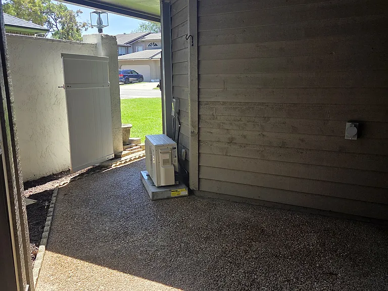 Outdoor Foyer Area face street. Home generator hookup to right of frame.