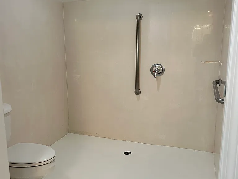 This is a roll in Wheelchair Accessible Shower located in the bathroom attached to the master bedroom.