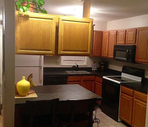 Tile floor kitchen with island.