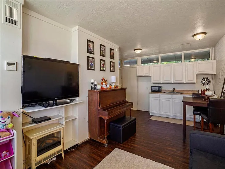Staged living room and kitchen at Kearney Apartment Homes.