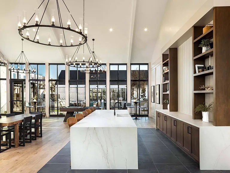 Step into our grand clubhouse, featuring soaring ceilings, elegant chandeliers, and inviting spaces to relax and connect.