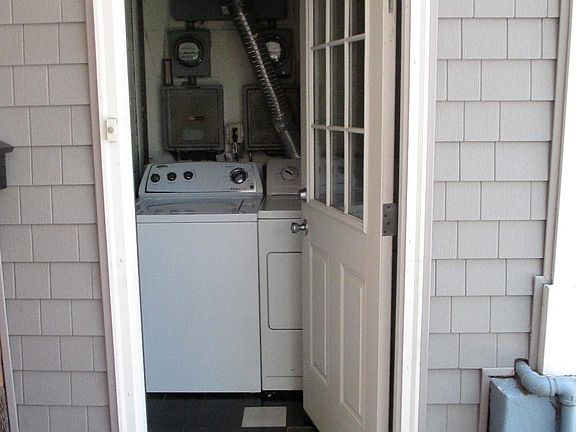 Door opens to unheated entry that houses Washer & Dryer