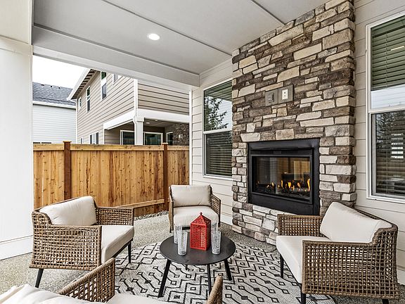 Covered outdoor living with fireplace