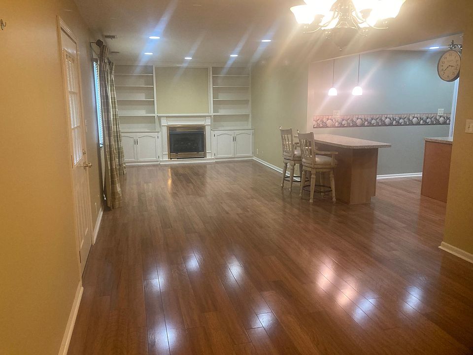 View from master bedroom into the dining room, family room and kitchen.