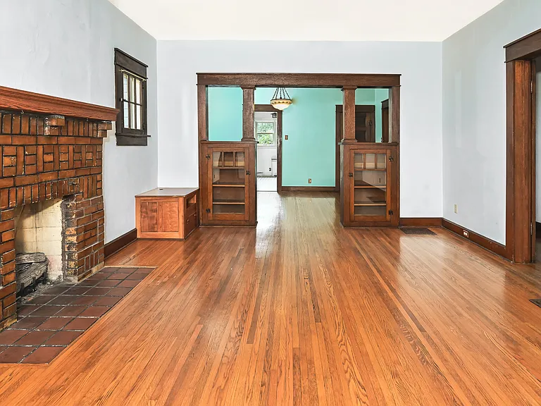 Living room with gas fireplace and built ins.