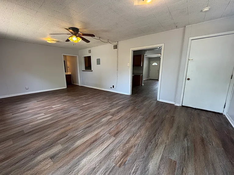 Back living area also includes access to the laundry room, a bathroom plus double doors to the backyard.