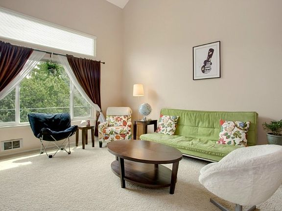 Large open living space with vaulted ceilings & skylight. Bright & spacious!