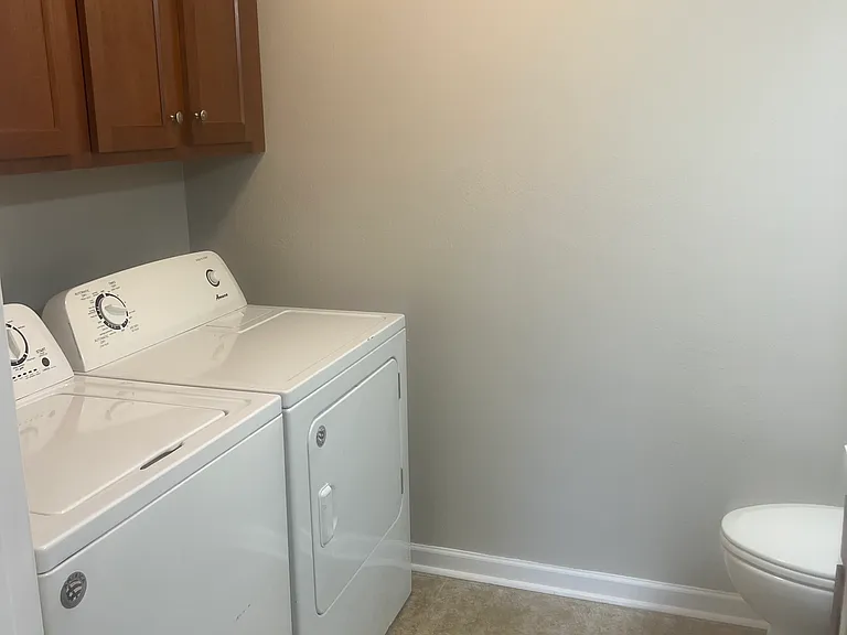 Laundry room off of the kitchen with 1/2 bath