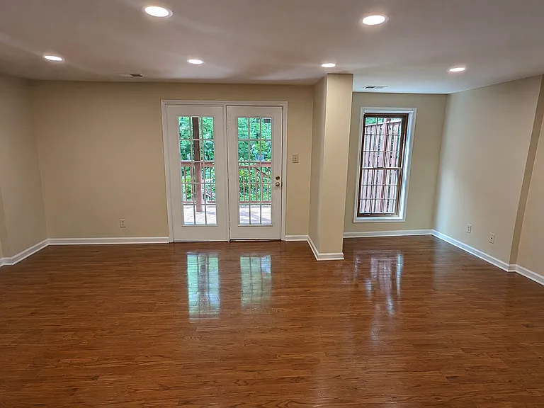 Lower walk out level with recreation media room that opens to large deck with steps to garden area. Perfect for large entertaining.