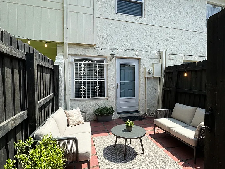 Private gated back patio virtually staged