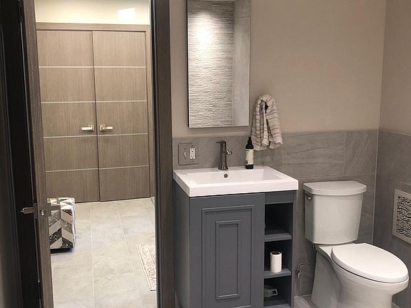 Master bath - looking into entry (W/D and storage behind double doors)