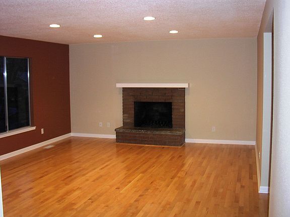 Spacious Living Room with hardwood floors, Woodburning Fireplace