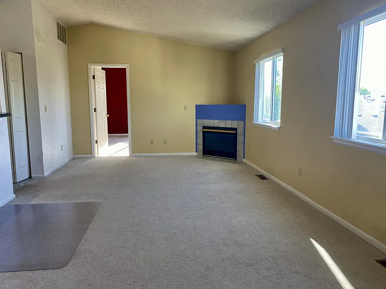 Large family room with plenty of space for your furniture and special touch.