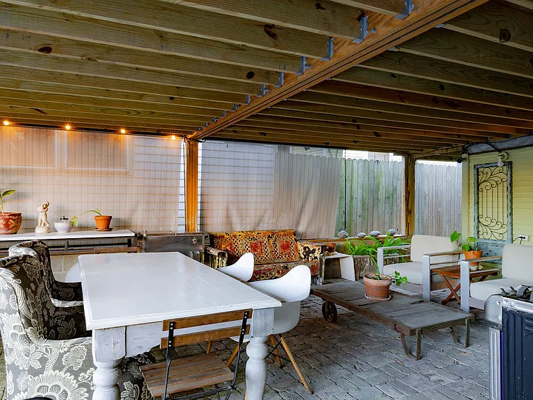 Covered Patio Area. Ready to Cook, Chill, Do Laundry or Enjoy the Water Features...