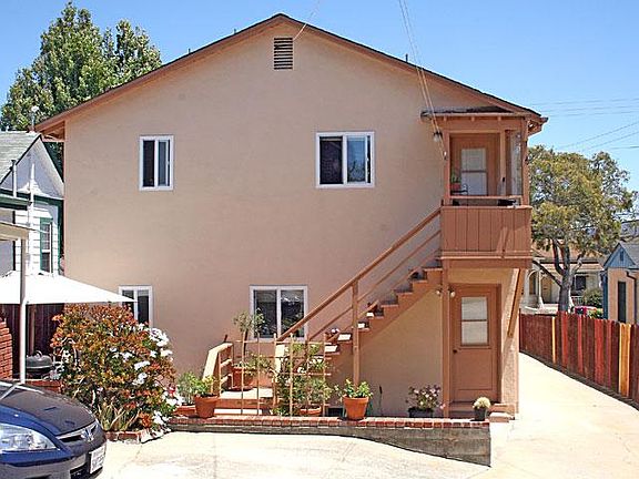 Rear of property. Unit 4 at top of stairs.