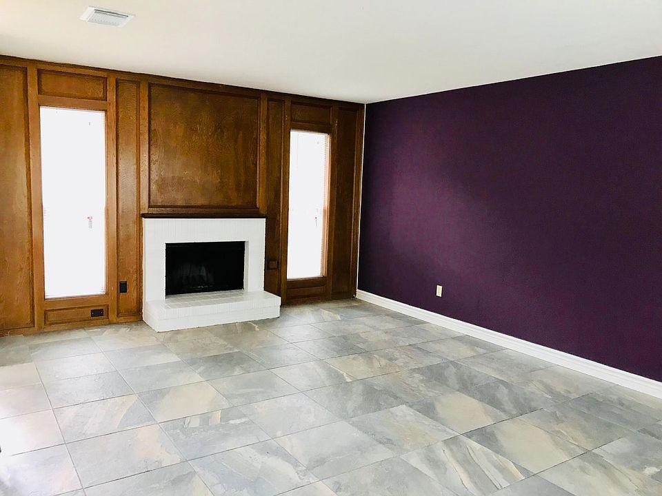 Beautiful tiled living room with a splash of color
