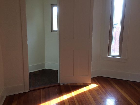Bedroom showing the triangular closet with the window