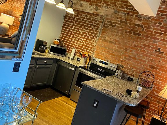 Fully contained kitchen with all stainless steel appliances. Dishwasher 
Washer/dryer