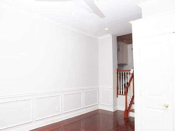 The front door enters to either a space for a dining room table or sitting area. Space has a closet for your coats, a key holder, and a bike rack that holds two bikes!