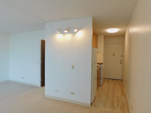 Through kitchen to front door.