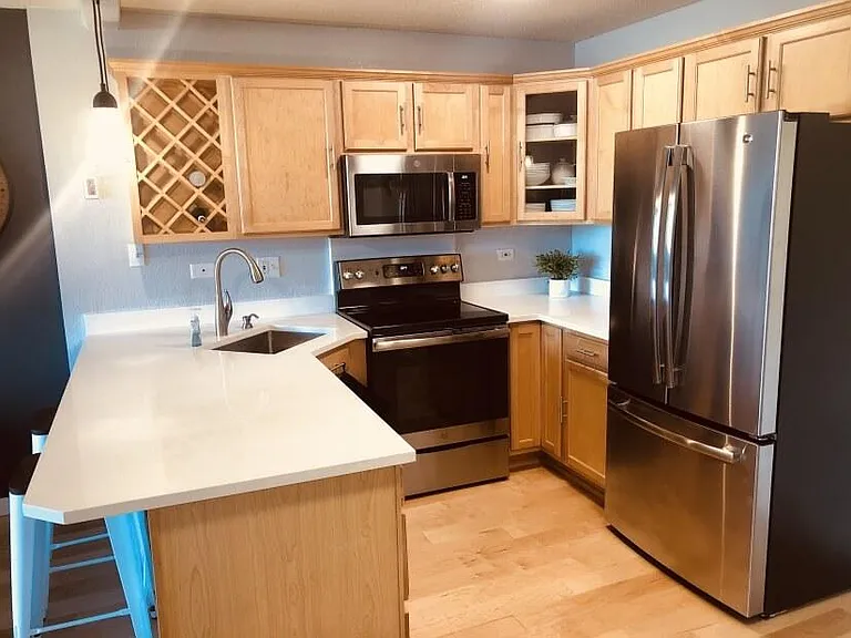 Beautiful fully stocked modern kitchen.