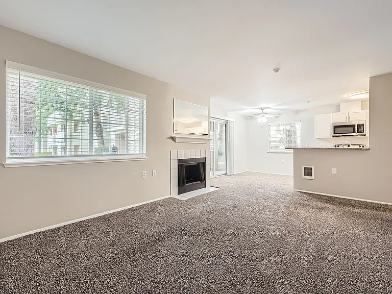 Living Room with Fireplace in a two-bedroom two-bath at Capitol City in Lacey, WA