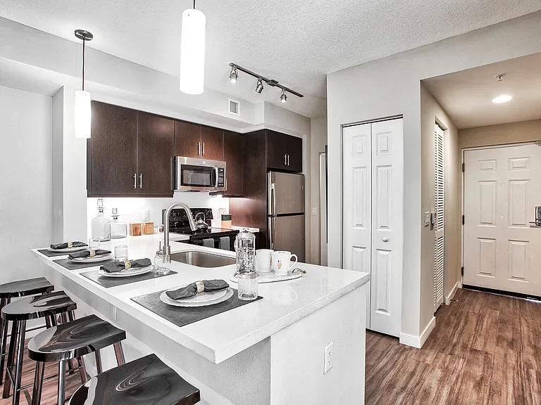 Kitchens with granite countertops and stainless steel appliances