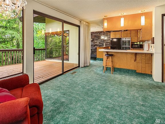 Family room off main level kitchen with side deck