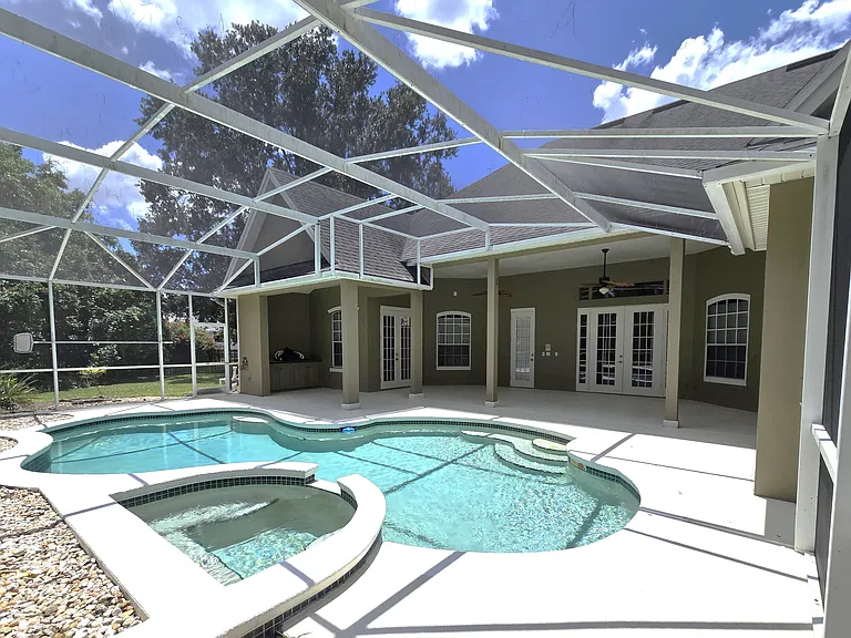 Expansive Screened Pool, Spa, and Lanai Entertainment Area
