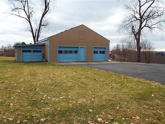 BONUS! 3 car outbuilding with a dedicated paved driveway!