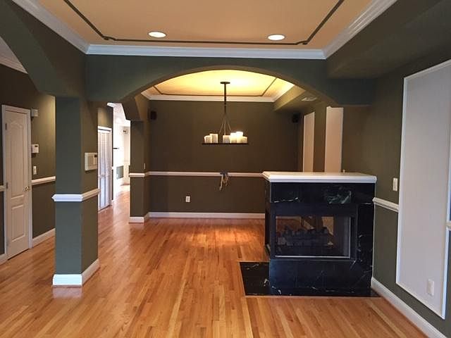 living room and dining room fireplace - unfurnished
