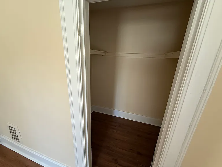 Upstairs front bedroom closet with shelving. Can walk in for plenty of storage space.