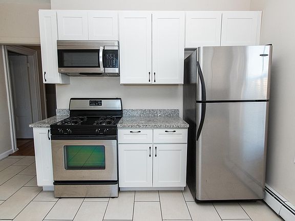 Kitchen with granite countertops and stainless steel appliances